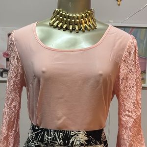 Size a small pink top with bows on the back